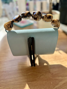 The Nica Leather Clutch in Sky Blue