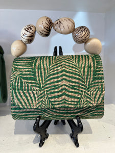 The Nica Rattan Clutch in Palma Green