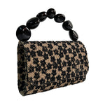 Load image into Gallery viewer, The Nica Rattan Clutch in Black Flowers
