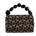 Load image into Gallery viewer, The Nica Rattan Clutch in Black Flowers
