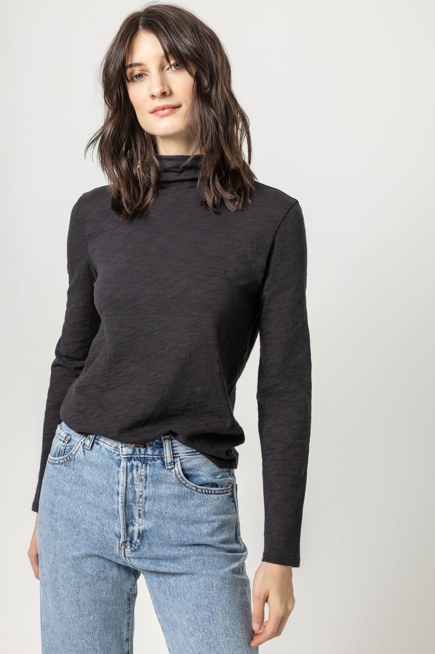 Shirttail Hem Funnel Neck in Black