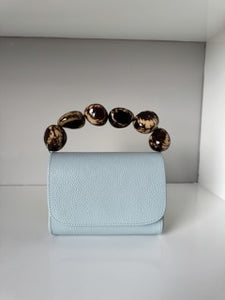 The Nica Leather Clutch in Sky Blue