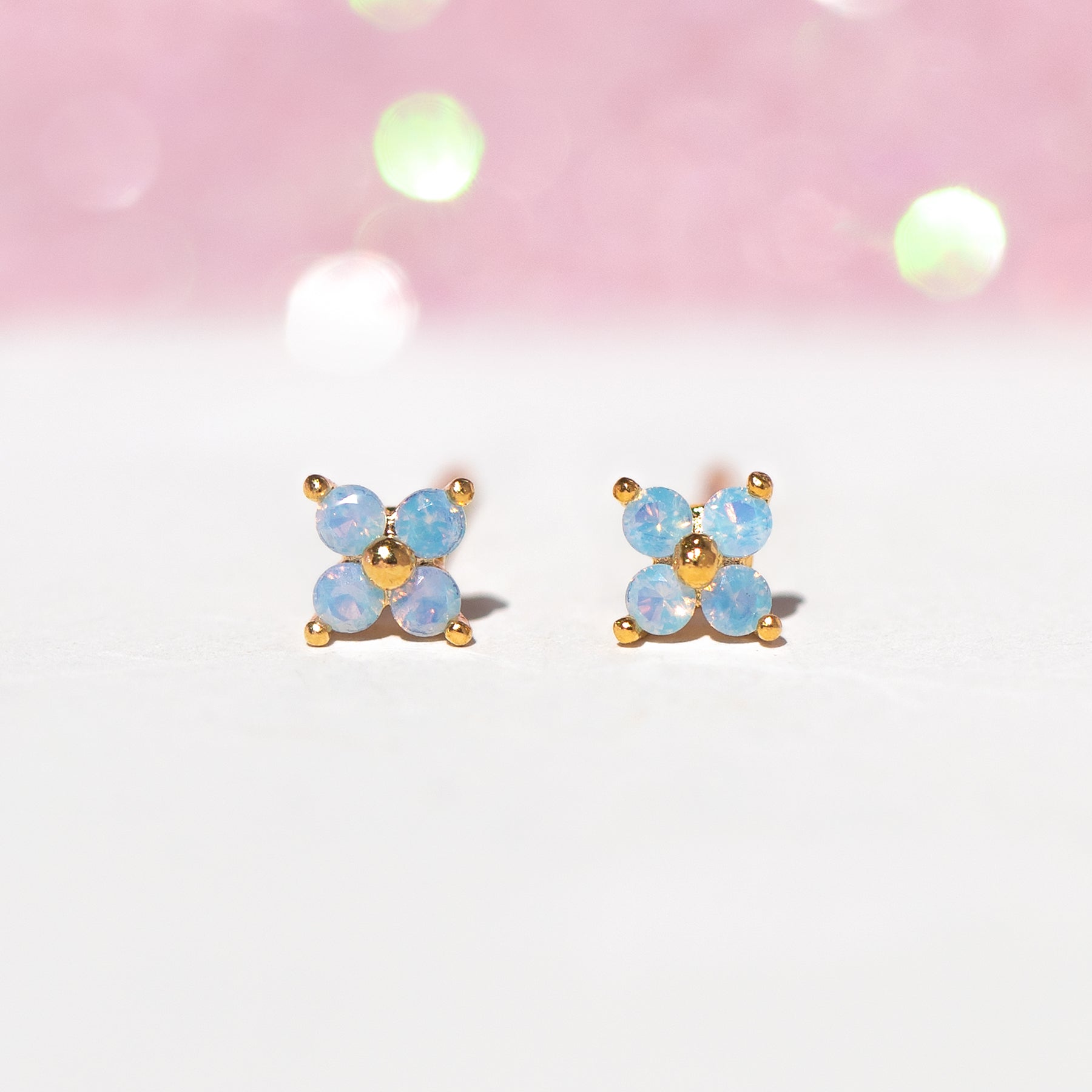 Teeny Tiny Blue Blossom Studs in Gold